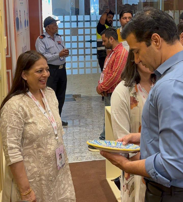 Our co-founder, Reema Bhasin with our specially designed 48 Kali Scalloped Plate
